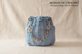Borsa azzurra su sfondo Maison du Crochet